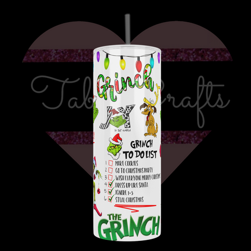 Steel tumbler cup with grinch to do list and various christmas decorations 